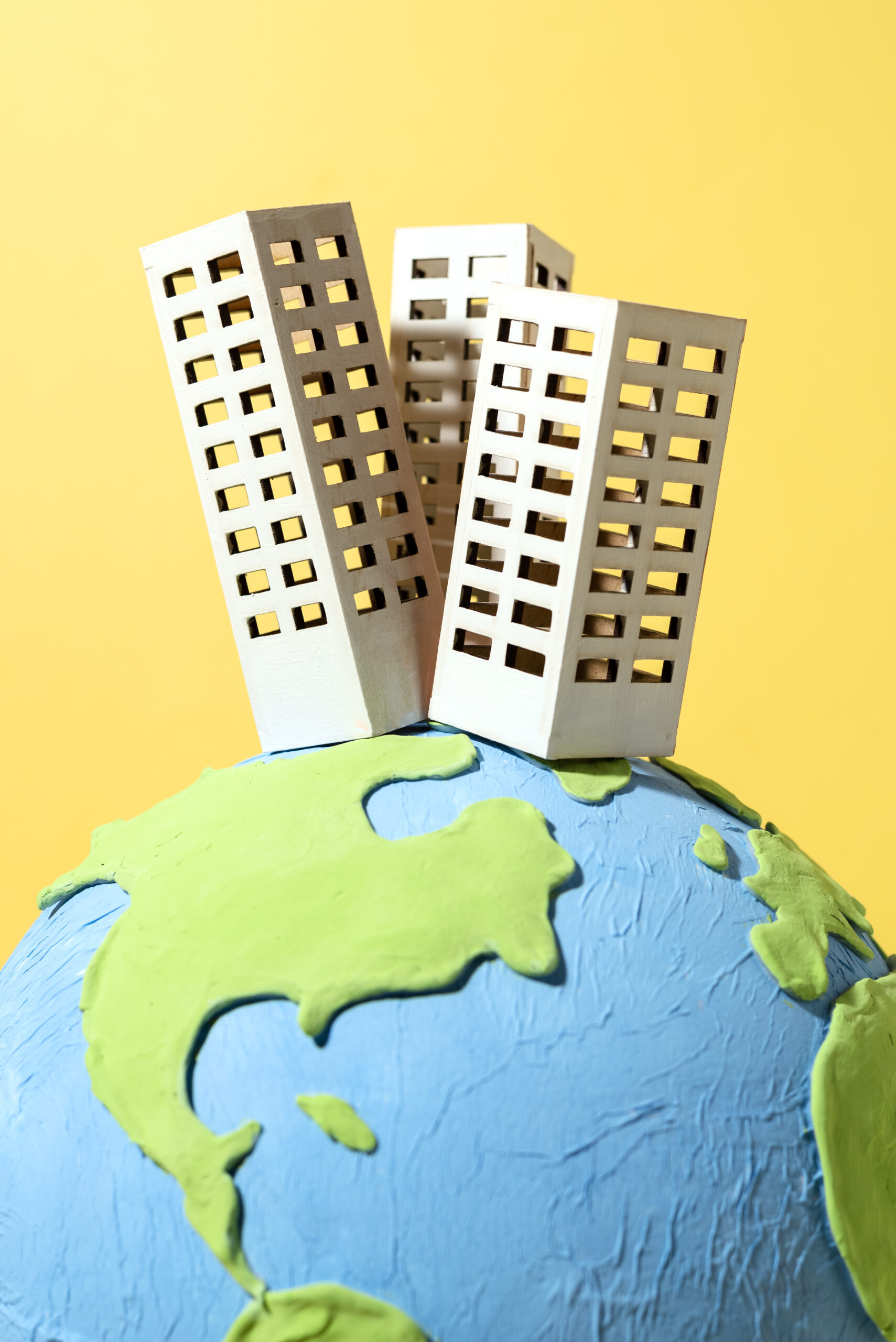 paper style earth globe with buildings